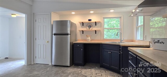6140 Barclay Ln, Clover, SC 29710 - kitchen featuring freestanding refrigerator, wall chimney exhaust hood, a sink, light countertops, and recessed lighting