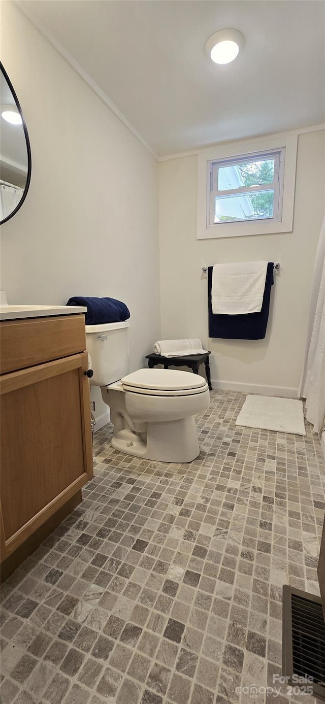 6140 Barclay Ln, Clover, SC 29710 - bathroom featuring toilet, brick patterned flooring, crown molding, vanity, and baseboards