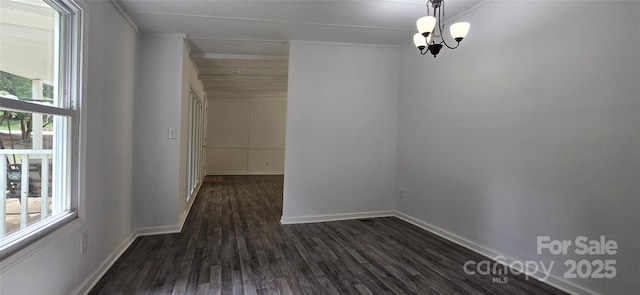 6140 Barclay Ln, Clover, SC 29710 - empty room with dark wood finished floors, baseboards, ornamental molding, and a chandelier