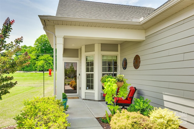 4511 Middlebury Ln, Fort Mill, SC 29715 - view of exterior entry featuring a shingled roof and a yard