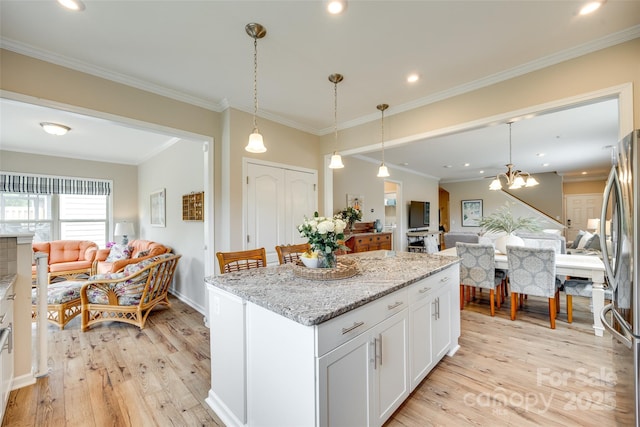 4511 Middlebury Ln, Fort Mill, SC 29715 - kitchen with open floor plan, light wood-type flooring, a center island, recessed lighting, and ornamental molding