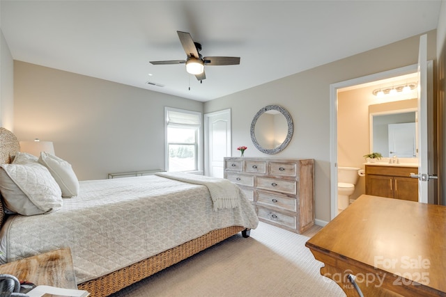 4511 Middlebury Ln, Fort Mill, SC 29715 - bedroom with light carpet, a sink, ensuite bathroom, and ceiling fan