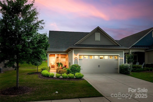 4511 Middlebury Ln, Fort Mill, SC 29715 - view of front facade featuring concrete driveway, a lawn, a garage, and roof with shingles