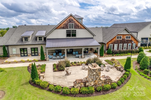 4511 Middlebury Ln, Fort Mill, SC 29715 - rear view of house with a standing seam roof, a patio area, french doors, metal roof, and a yard