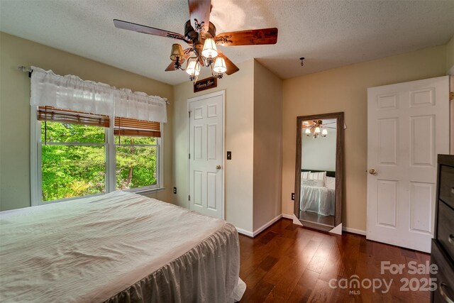 354 Ivy Ridge Cir, Sylva, NC 29779 - bedroom with hardwood / wood-style floors, baseboards, a textured ceiling, and ceiling fan