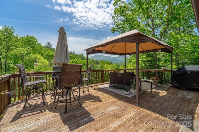 354 Ivy Ridge Cir, Sylva, NC 29779 - wooden deck with a gazebo, outdoor lounge area, a mountain view, outdoor dining area, and grilling area