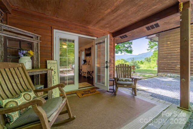 354 Ivy Ridge Cir, Sylva, NC 29779 - sunroom featuring french doors and a mountain view