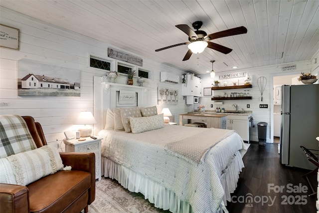 354 Ivy Ridge Cir, Sylva, NC 29779 - bedroom with freestanding refrigerator, a wall unit AC, wooden ceiling, a sink, and wooden walls