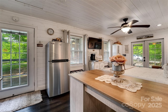 354 Ivy Ridge Cir, Sylva, NC 29779 - kitchen featuring freestanding refrigerator, healthy amount of natural light, wood ceiling, french doors, and wooden walls