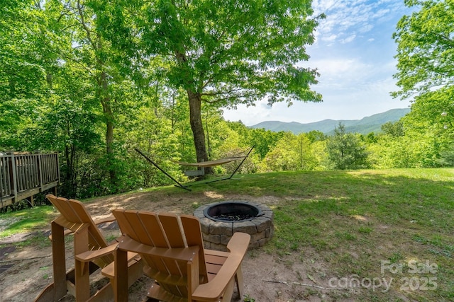 354 Ivy Ridge Cir, Sylva, NC 29779 - view of yard featuring an outdoor fire pit, a mountain view, and a view of trees