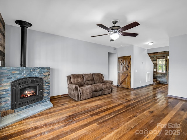 4830 Chesnee Rd, Rutherfordton, NC 28139 - living area with wood finished floors, ceiling fan, and baseboards