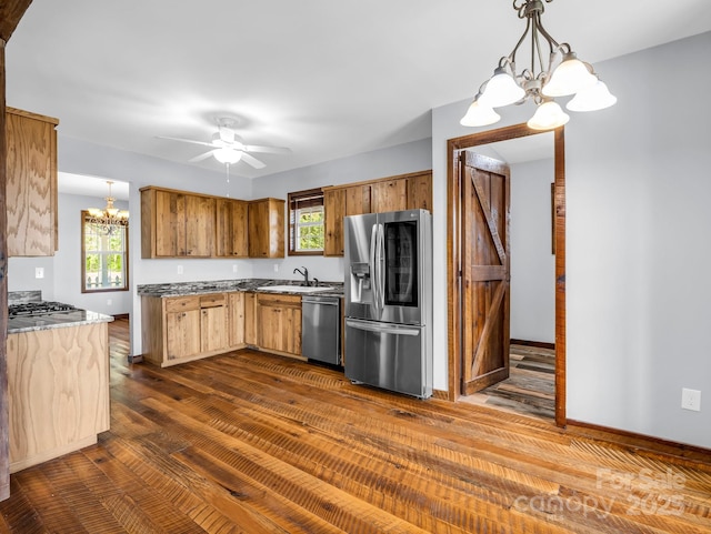 4830 Chesnee Rd, Rutherfordton, NC 28139 - kitchen with stainless steel appliances, a chandelier, a sink, dark wood-style flooring, and pendant lighting