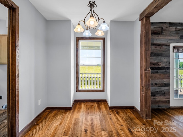 4830 Chesnee Rd, Rutherfordton, NC 28139 - foyer with plenty of natural light, wood finished floors, a chandelier, and baseboards