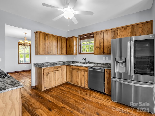 4830 Chesnee Rd, Rutherfordton, NC 28139 - kitchen with appliances with stainless steel finishes, a sink, dark wood-type flooring, and brown cabinetry