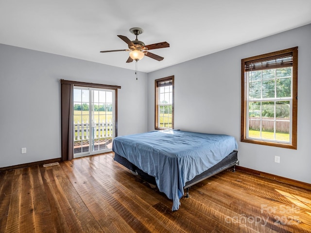 4830 Chesnee Rd, Rutherfordton, NC 28139 - bedroom featuring baseboards, access to exterior, wood finished floors, and a ceiling fan