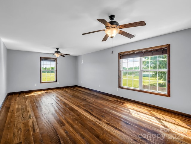 4830 Chesnee Rd, Rutherfordton, NC 28139 - empty room featuring dark wood-type flooring, baseboards, and a ceiling fan