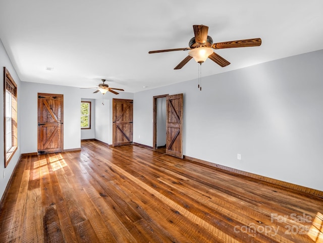 4830 Chesnee Rd, Rutherfordton, NC 28139 - unfurnished living room with ceiling fan, wood-type flooring, and baseboards