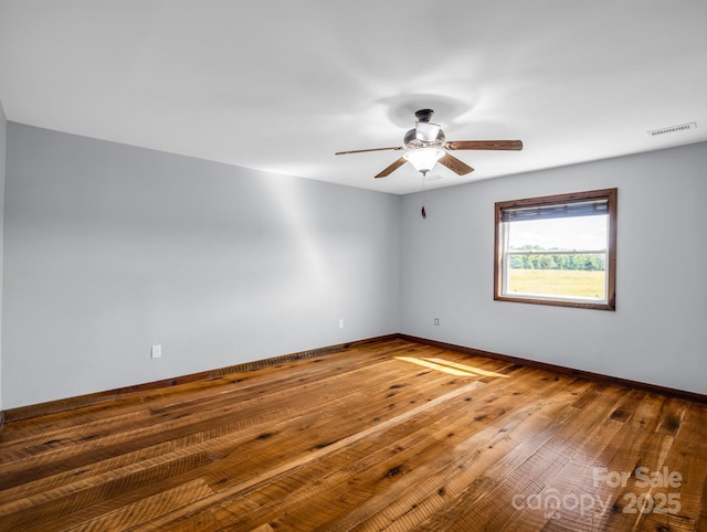 4830 Chesnee Rd, Rutherfordton, NC 28139 - empty room featuring a ceiling fan, baseboards, and hardwood / wood-style floors