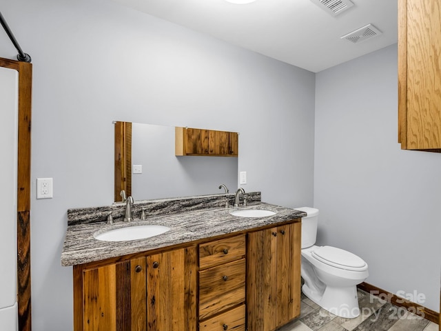 4830 Chesnee Rd, Rutherfordton, NC 28139 - bathroom featuring toilet and double vanity