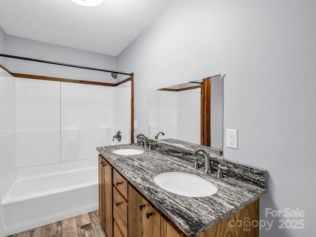 4830 Chesnee Rd, Rutherfordton, NC 28139 - bathroom with wood finished floors, double vanity, and shower / bathtub combination