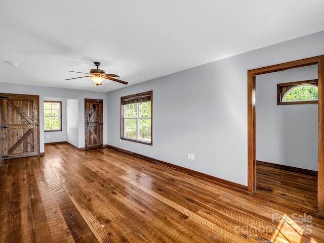 4830 Chesnee Rd, Rutherfordton, NC 28139 - empty room featuring healthy amount of natural light, baseboards, wood finished floors, and ceiling fan