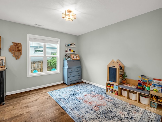 725 Center St, Asheville, NC 28803 - game room featuring wood finished floors and baseboards