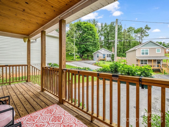 725 Center St, Asheville, NC 28803 - wooden deck featuring view of wooded area
