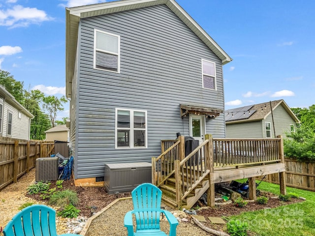 725 Center St, Asheville, NC 28803 - back of house with central AC unit, a deck, a jacuzzi, and a fenced backyard