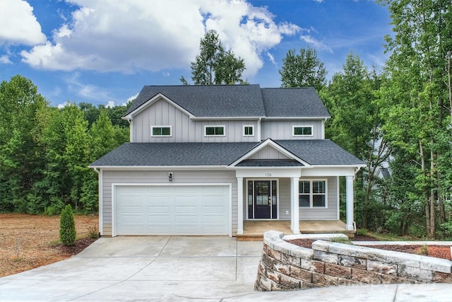 126 Meadow Glen Dr, Troutman, NC 28166 - view of front facade with driveway, covered porch, and a shingled roof