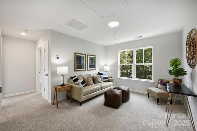 126 Meadow Glen Dr, Troutman, NC 28166 - living room with attic access, carpet, and baseboards
