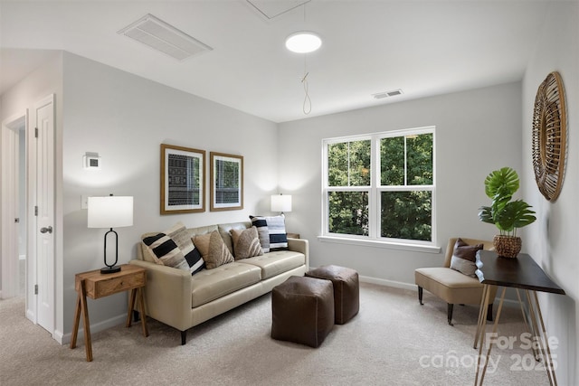 126 Meadow Glen Dr, Troutman, NC 28166 - living area featuring light colored carpet, baseboards, and attic access