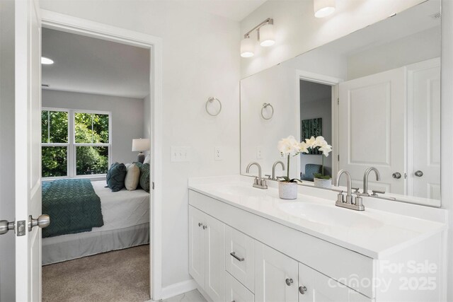 126 Meadow Glen Dr, Troutman, NC 28166 - ensuite bathroom with double vanity and baseboards