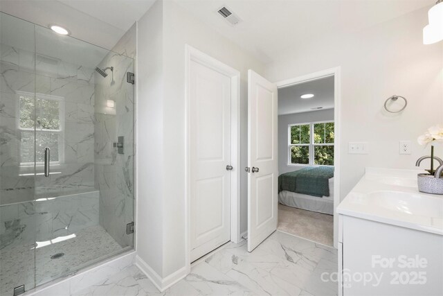 126 Meadow Glen Dr, Troutman, NC 28166 - bathroom featuring marble finish flooring, a marble finish shower, ensuite bath, baseboards, and vanity