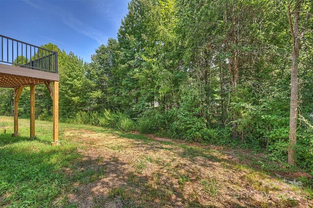 126 Meadow Glen Dr, Troutman, NC 28166 - view of yard with a wooden deck