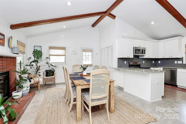 5929 Brookhaven Rd, Charlotte, NC 28210 - dining area with a fireplace and recessed lighting