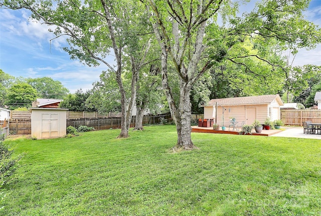 5929 Brookhaven Rd, Charlotte, NC 28210 - view of yard featuring a wooden deck and a patio