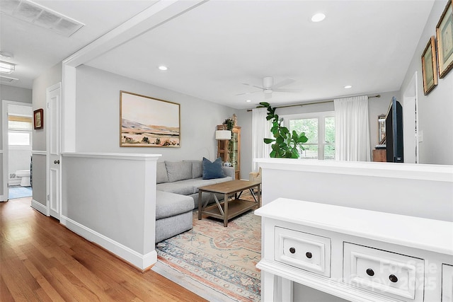 5929 Brookhaven Rd, Charlotte, NC 28210 - living area with light wood-style floors, a ceiling fan, recessed lighting, and baseboards