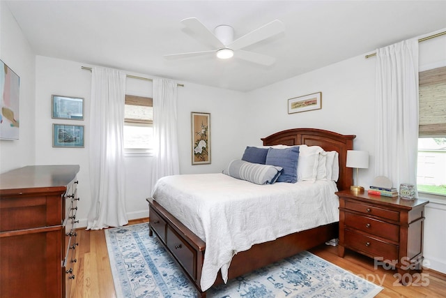 5929 Brookhaven Rd, Charlotte, NC 28210 - bedroom featuring multiple windows, light wood-type flooring, and ceiling fan