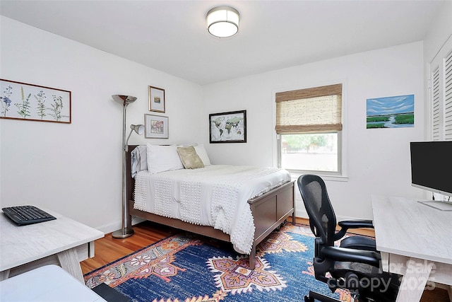 5929 Brookhaven Rd, Charlotte, NC 28210 - bedroom featuring wood finished floors, baseboards, and an office area