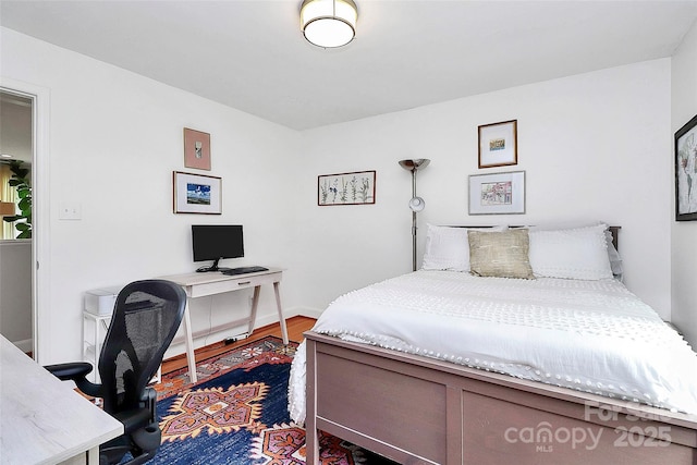 5929 Brookhaven Rd, Charlotte, NC 28210 - bedroom featuring an office area and wood finished floors