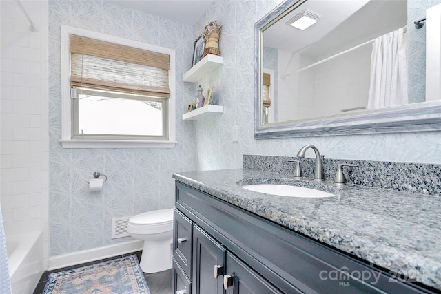 5929 Brookhaven Rd, Charlotte, NC 28210 - full bathroom featuring vanity, wallpapered walls, toilet, and shower / bathtub combination with curtain