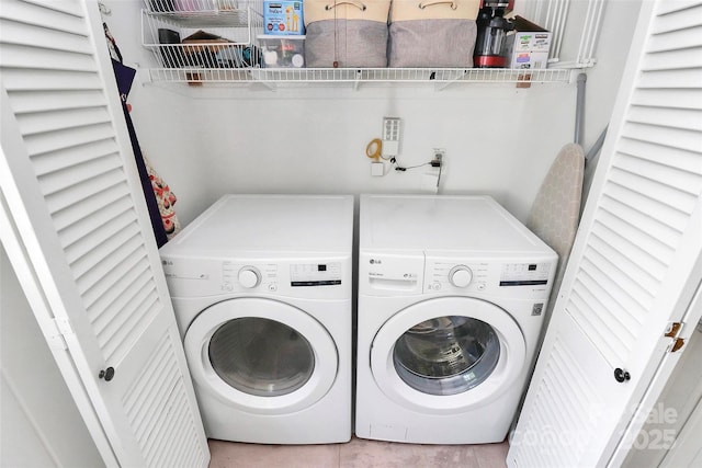 5929 Brookhaven Rd, Charlotte, NC 28210 - washroom with washing machine and clothes dryer and tile patterned flooring