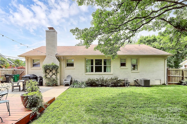 5929 Brookhaven Rd, Charlotte, NC 28210 - rear view of house featuring brick siding, a chimney, a deck, and central air condition unit
