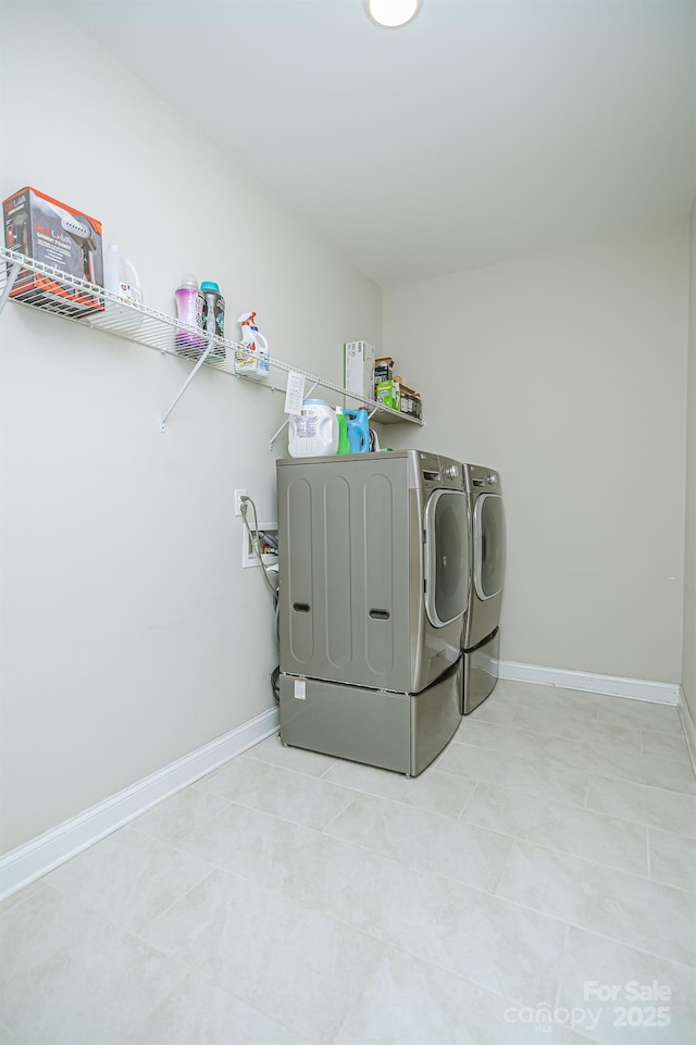 424 Cassia Ct, Fort Mill, SC 29708 - laundry area with washing machine and dryer, baseboards, and light tile patterned floors