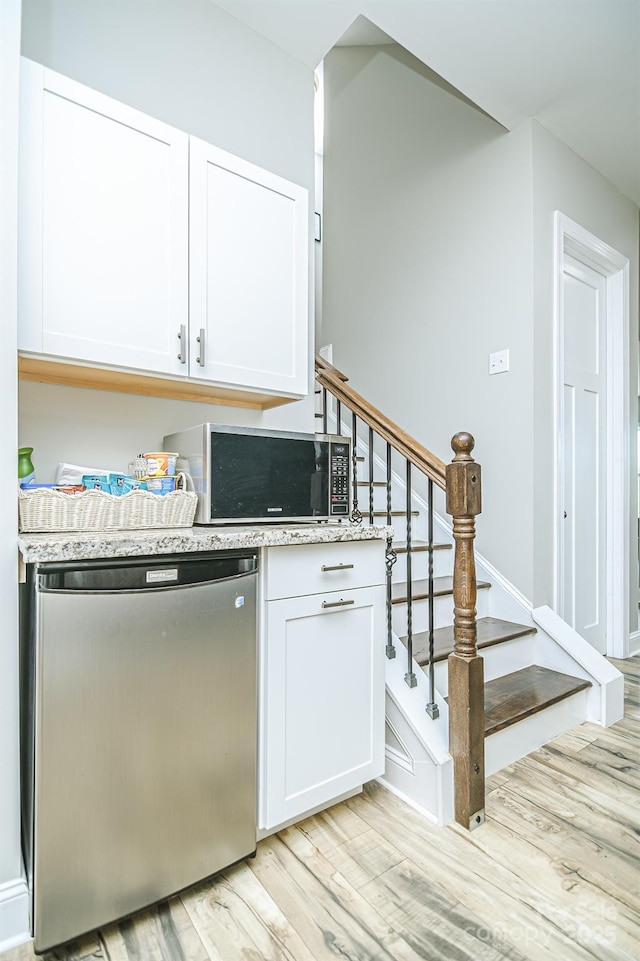 424 Cassia Ct, Fort Mill, SC 29708 - kitchen featuring dishwashing machine, stainless steel microwave, light wood-style flooring, and white cabinets