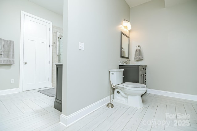 424 Cassia Ct, Fort Mill, SC 29708 - bathroom featuring a shower, vanity, baseboards, and toilet