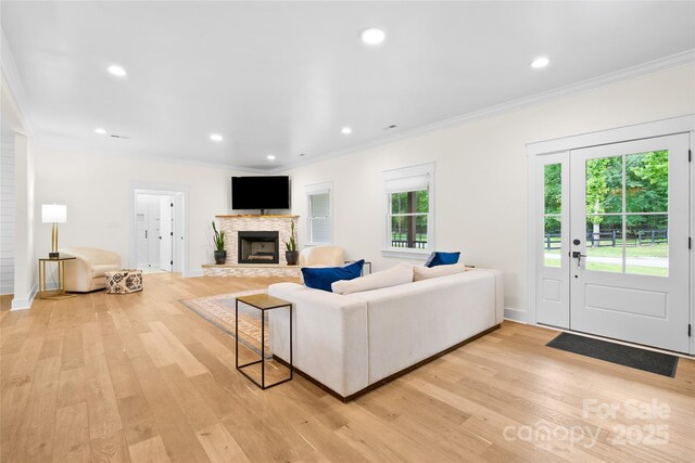 94 Jamestown Ln, Columbus, NC 28722 - living area featuring crown molding, light wood-style floors, a fireplace, recessed lighting, and baseboards