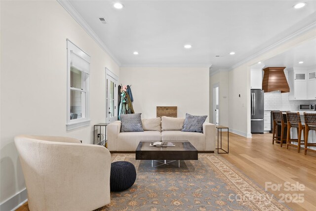 94 Jamestown Ln, Columbus, NC 28722 - living room with light wood-type flooring, crown molding, recessed lighting, and baseboards