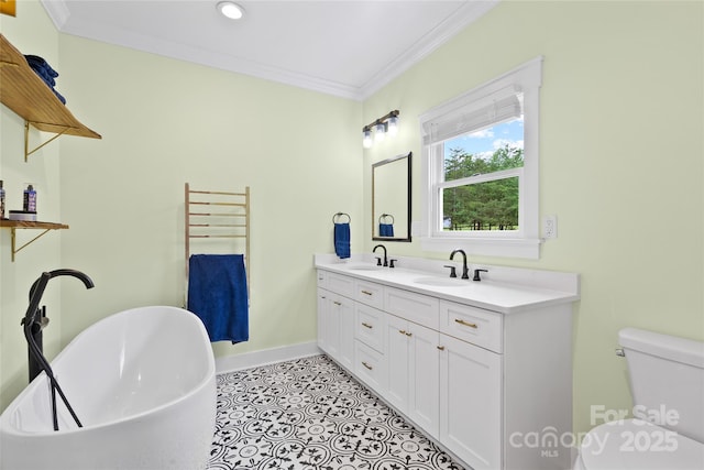 94 Jamestown Ln, Columbus, NC 28722 - bathroom with a freestanding bath, crown molding, double vanity, baseboards, and toilet