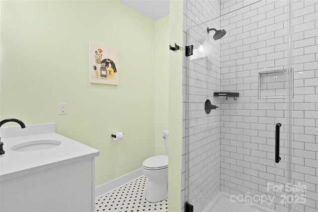 94 Jamestown Ln, Columbus, NC 28722 - bathroom featuring a shower stall, toilet, vanity, and baseboards